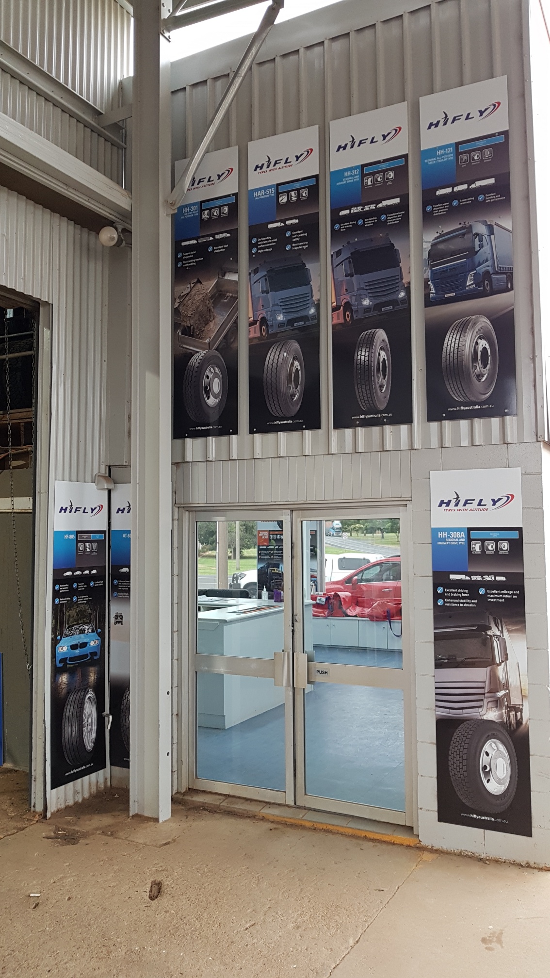 The workshop entrance at Walker’s Service Centre with heavy truck tyre displays